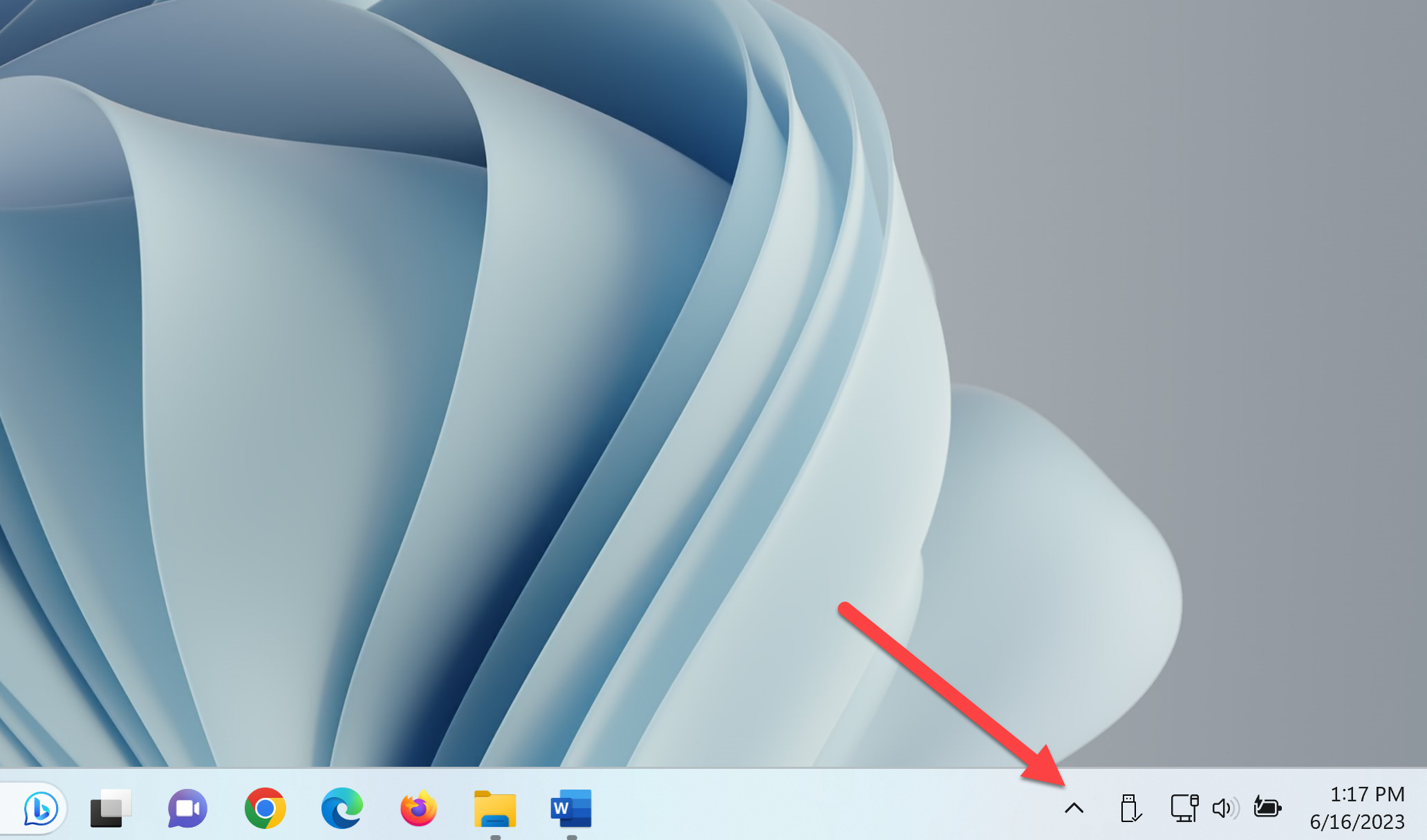 The Taskbar corner showing System Tray icons and the Show Hidden Icons button.